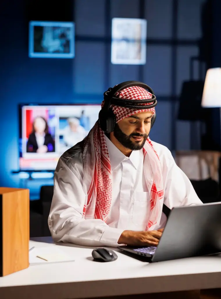 Arab developer working on a mobile app project in Dubai